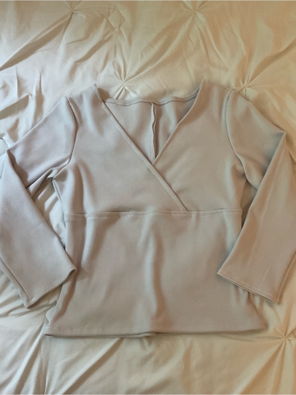 Grey three-quarter sleeve ribbed knit wrap top